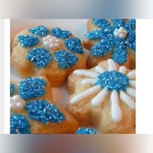 Set of two Wilson  cookie baking pans, holiday snowflakes and Girl stuff